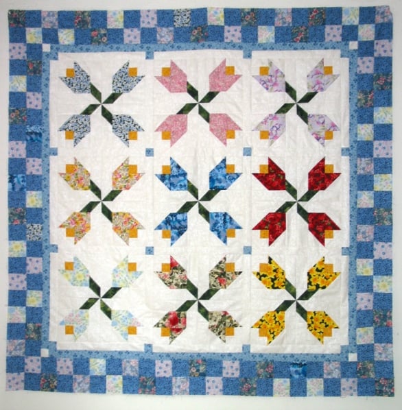 Free Quilt Pattern - Scrappy Spring Tulips Baby Quilt by Carter Quilter